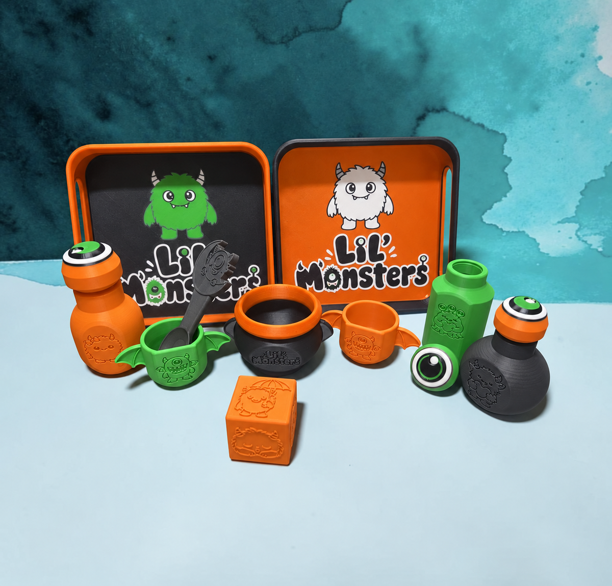 Lil’ Monsters 3D-printed activity set mockup in a pumpkin colorway
